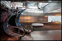 Curved moving staircase and meeeting room, Bloomberg building. NYC, New York, USA