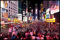 Crowds on Times Squares at night. NYC, New York, USA