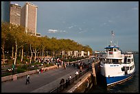 Tour boat along Battery Park, evening. NYC, New York, USA (color)