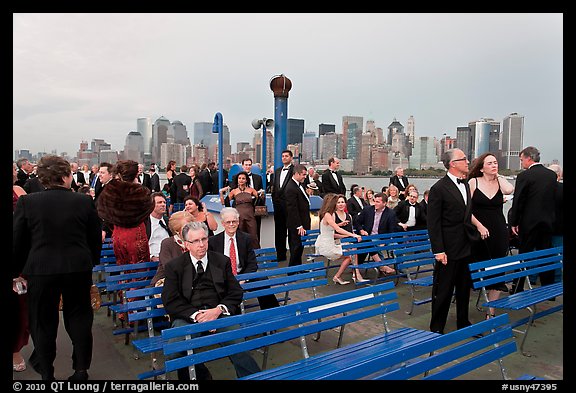 Black Tie gala guests on boat deck, New York harbor. NYC, New York, USA (color)
