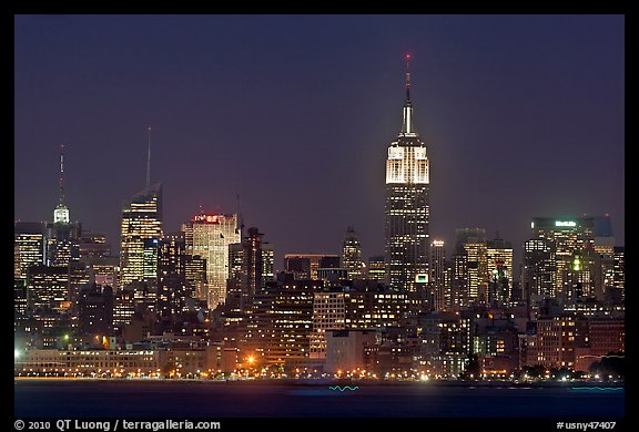 Mid-town Manhattan skyline by night. NYC, New York, USA (color)