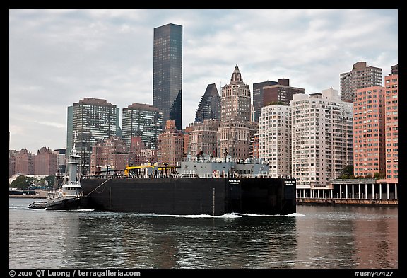 Barge on Hudson River and Manhattan waterfront. NYC, New York, USA (color)