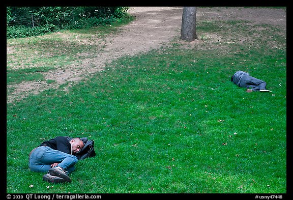 Men sleeping on lawn, Central Park. NYC, New York, USA (color)