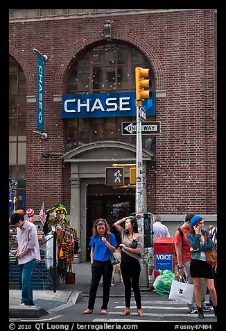 People waiting at crosswalk amidst bubbles. NYC, New York, USA (color)