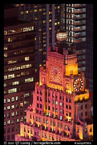 Top of vintage high-rise building with globe and clocks. NYC, New York, USA (color)