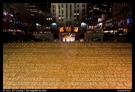 Rockefeller plaza and rink by night with Credo plaque. NYC, New York, USA