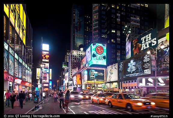 Yellow taxicabs, Times Squares at night. NYC, New York, USA (color)