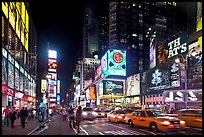 Yellow taxicabs, Times Squares at night. NYC, New York, USA