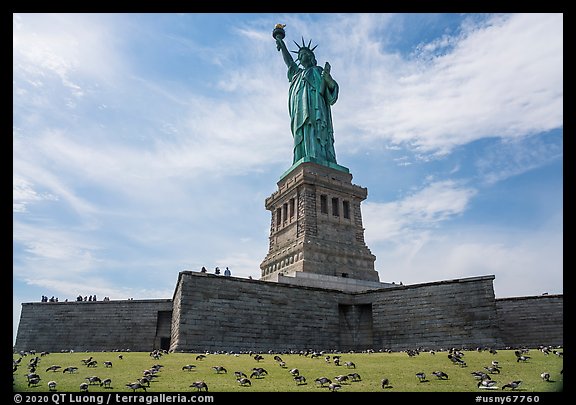 Statue of Liberty from lawn with pigeons, Statue of Liberty National Monument. NYC, New York, USA (color)