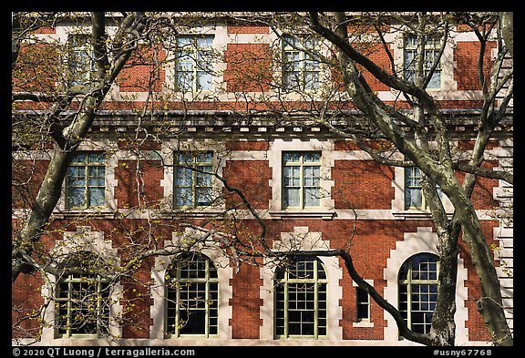 Trees and main building facade, Ellis Island, Statue of Liberty National Monument. NYC, New York, USA (color)