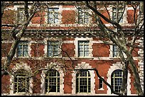 Trees and main building facade, Ellis Island, Statue of Liberty National Monument. NYC, New York, USA ( color)