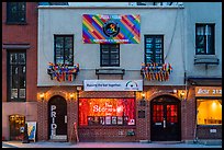 Stonewall Inn building facade with gay pride flags. NYC, New York, USA ( color)
