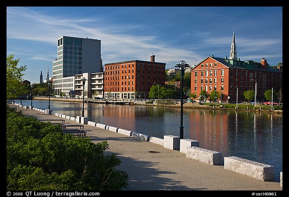 Brick buildings reflected in Seekonk river, late afternoon. Providence, Rhode Island, USA