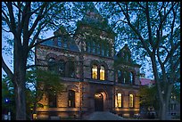 Sayles Hall framed by trees at dusk, Brown University. Providence, Rhode Island, USA