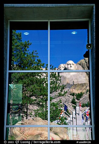 Cliff and sculptures reflected in a window, Mount Rushmore National Memorial. South Dakota, USA (color)
