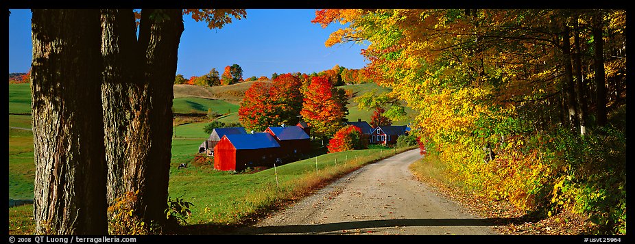 Pastoral view with road and farm in autumn. Vermont, New England, USA