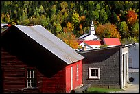 Red barn and East Topsham village in fall. Vermont, New England, USA