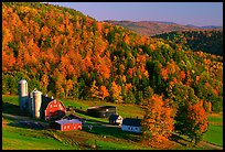 Farm surrounded by hills in fall foliage. Vermont, New England, USA (color)