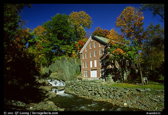 Old Mill next to a cascading brook near Stowe. Vermont, New England, USA (color)