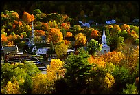 Village surounded by trees in brilliant autumn foliage. Vermont, New England, USA (color)