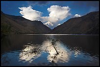 Thunderstorm clouds at sunrise reflected in reservoir. Hells Canyon National Recreation Area, Idaho and Oregon, USA (color)