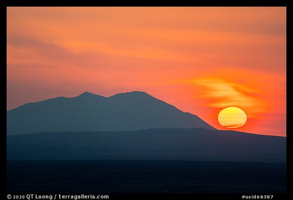 Sun rising and Big Southern Butte. Craters of the Moon National Monument and Preserve, Idaho, USA (color)