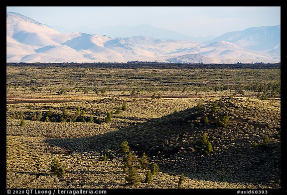 Snake River Plain with cinder cones and Pioneer Mountains. Craters of the Moon National Monument and Preserve, Idaho, USA (color)