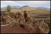 Colorful lava rocks of Echo Crater, Big Cinder Butte, and Pioneer Mountains. Craters of the Moon National Monument and Preserve, Idaho, USA ( color)