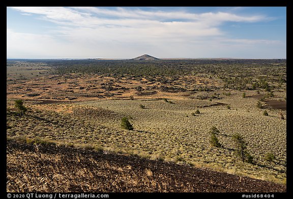 Red cinders of Echo Crater, Big Cinder Butte, and Pioneer Mountains. Craters of the Moon National Monument and Preserve, Idaho, USA (color)