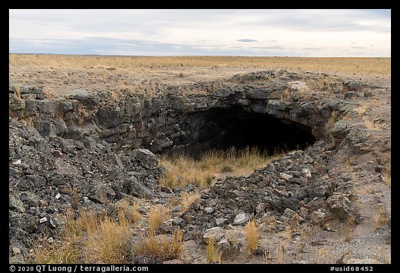 Plain with Bear Trap Cave entrance. Craters of the Moon National Monument and Preserve, Idaho, USA (color)