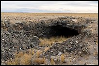 Plain with Bear Trap Cave entrance. Craters of the Moon National Monument and Preserve, Idaho, USA ( color)