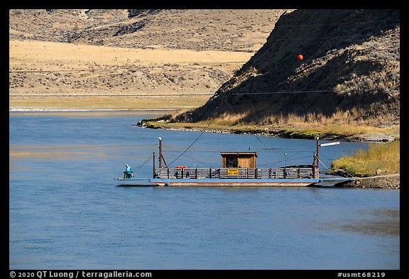 Operator fishing on McClelland Stafford Ferry. Upper Missouri River Breaks National Monument, Montana, USA (color)