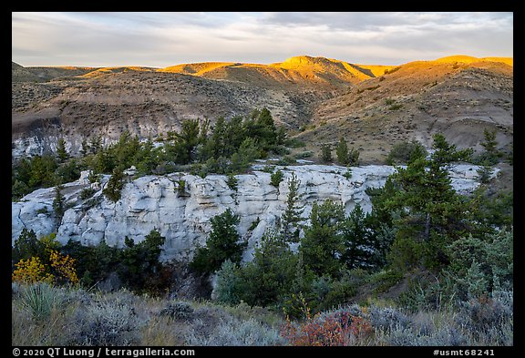 Sandstone pinnacles and hill with last light. Upper Missouri River Breaks National Monument, Montana, USA (color)