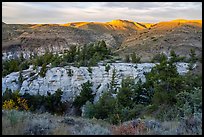 Sandstone pinnacles and hill with last light. Upper Missouri River Breaks National Monument, Montana, USA ( color)