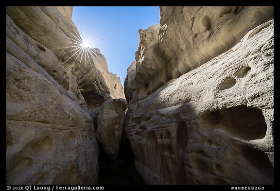 Sandstone walls of Neat Coulee slot canyon and sun. Upper Missouri River Breaks National Monument, Montana, USA (color)