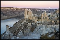 Sandstone pinnacles and moon. Upper Missouri River Breaks National Monument, Montana, USA ( color)