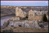 Sandstone spires and moon at twilight. Upper Missouri River Breaks National Monument, Montana, USA ( color)