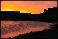 Distant Hole-in-the-Wall at sunrise. Upper Missouri River Breaks National Monument, Montana, USA ( color)