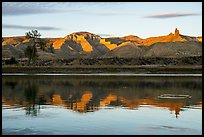 Riverbank with cliff and spires at sunset. Upper Missouri River Breaks National Monument, Montana, USA ( color)