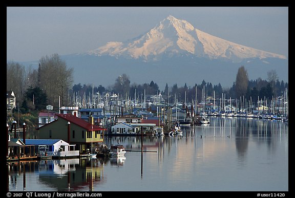 Houseboats on North Portland Harbor and snow-covered Mt Hood. Portland, Oregon, USA