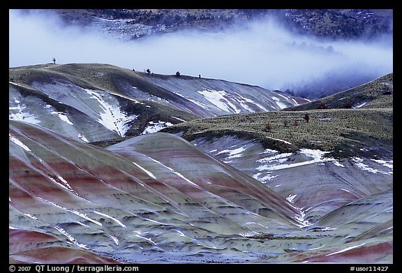 Painted hills with snow and fog. John Day Fossils Bed National Monument, Oregon, USA