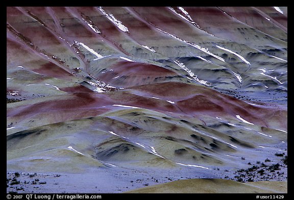 Colorful strata and snow on painted hills. John Day Fossils Bed National Monument, Oregon, USA