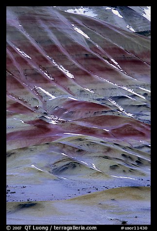 Colorful strata and snow on claystone hills. John Day Fossils Bed National Monument, Oregon, USA (color)