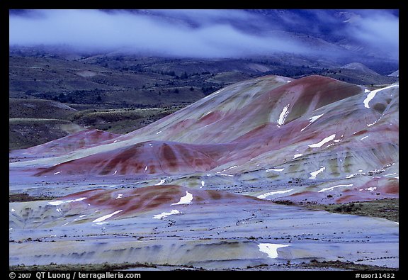 Painted hills and fog, winter dusk. John Day Fossils Bed National Monument, Oregon, USA