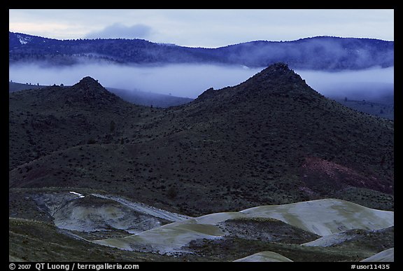 Buttes and fog at dusk. John Day Fossils Bed National Monument, Oregon, USA (color)
