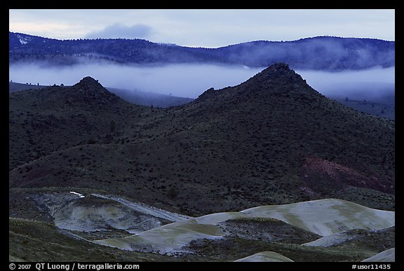 Buttes and fog at dusk. John Day Fossils Bed National Monument, Oregon, USA