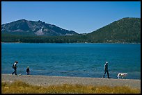 Family strolling on shore of East Lake. Newberry Volcanic National Monument, Oregon, USA