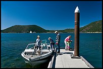 Family boarding boat, East Lake. Newberry Volcanic National Monument, Oregon, USA