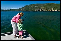 Mother and daughter on deck, East Lake. Newberry Volcanic National Monument, Oregon, USA (color)