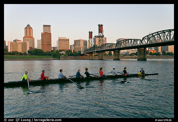 Eight-oar shell on Williamette River and city skyline. Portland, Oregon, USA